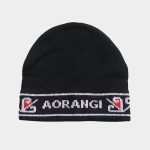 Black knitted Māori Iwi beanie with a white and red border pattern, and white lettering spelling "Aorangi" across the front.